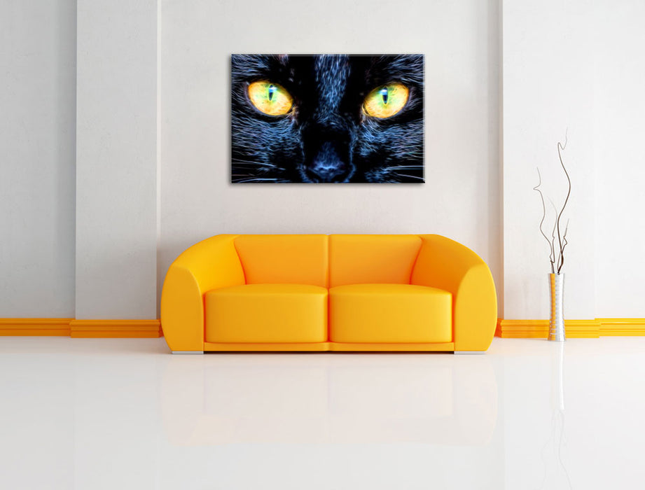 Schwarze Katze mit gelben Augen Leinwandbild über Sofa