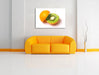 Leckere Kiwi mit Orangenschale Leinwandbild über Sofa