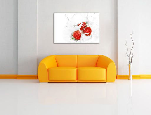 Leckere Erdbeeren in Milch Leinwandbild über Sofa