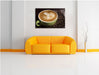 Cappucino zwischen Kaffeebohnen Leinwandbild über Sofa
