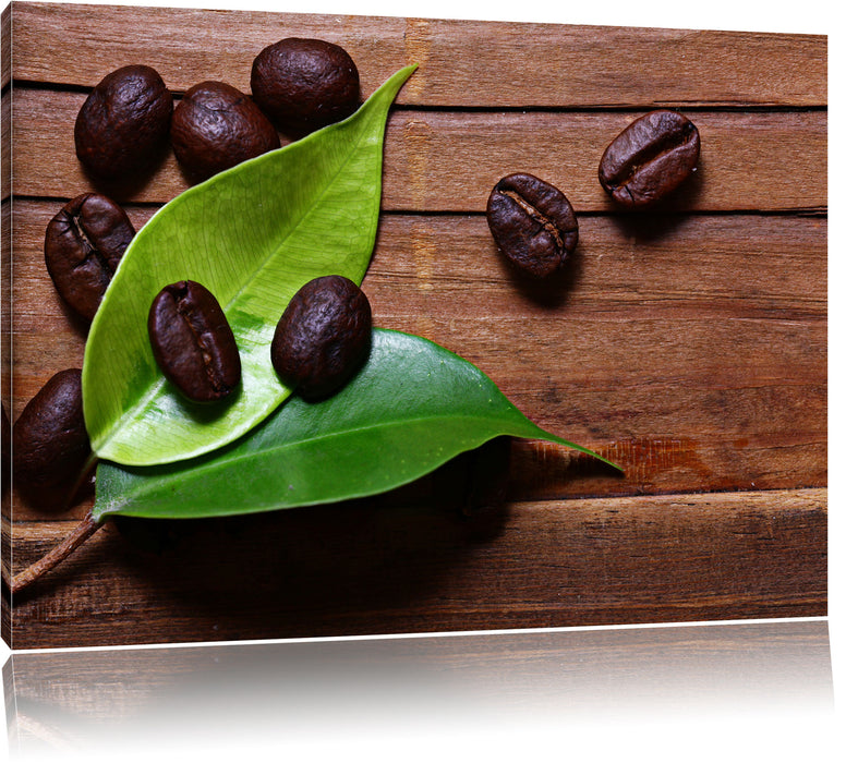 Pixxprint Kaffeebohnen auf Blätern, Leinwandbild