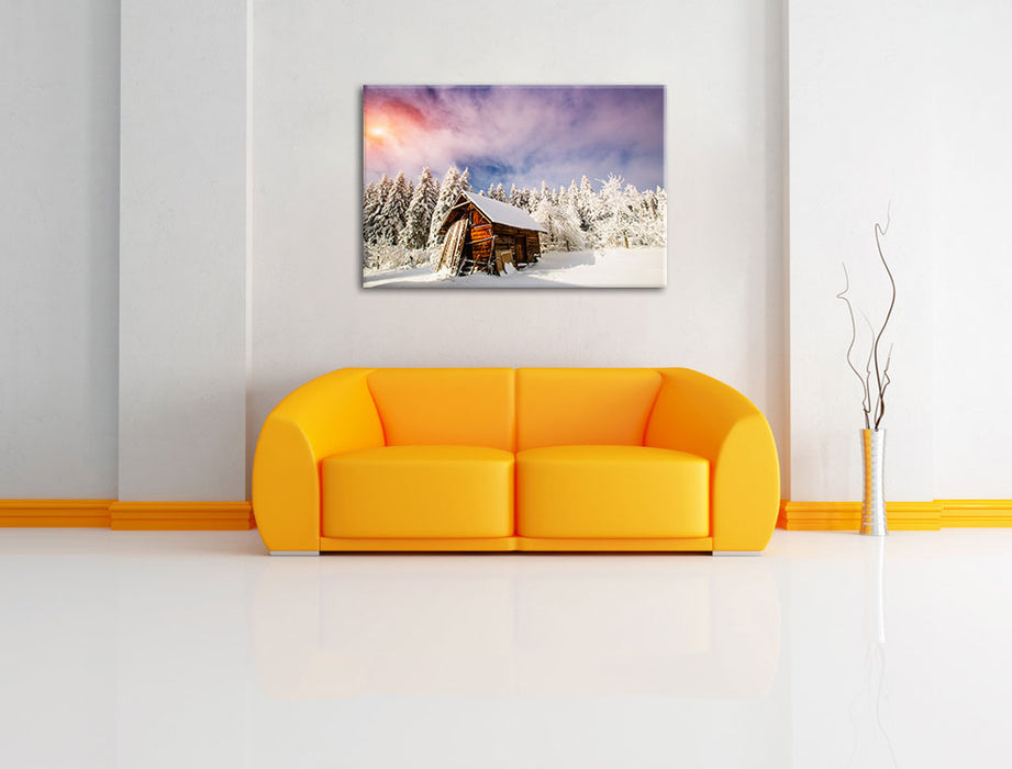 Holzhütte im Schnee Leinwandbild über Sofa