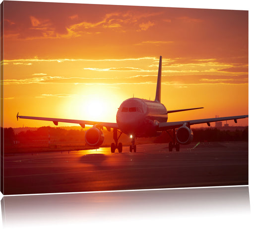 Flugzeug im Sonnenuntergang Leinwandbild