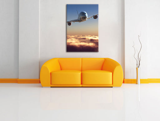 Flugzeug über den Wolken Leinwandbild über Sofa