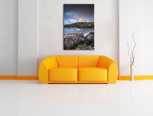 Leuchtturm im Meer Leinwandbild über Sofa
