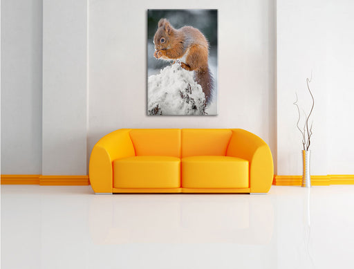 Kleines Eichhörnchen im Winter Leinwandbild über Sofa