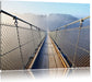 Hängeseilbrücke im Nebelschimmer Leinwandbild