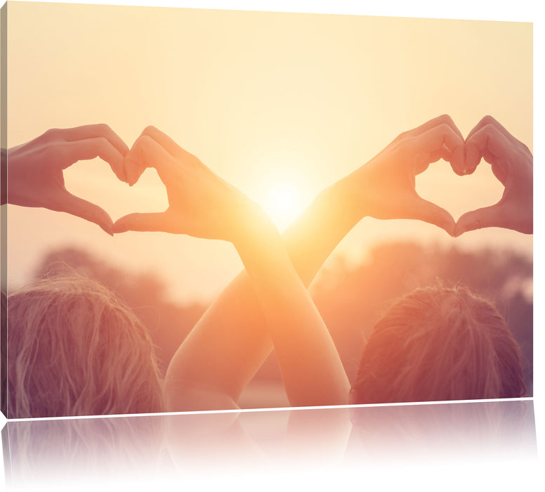 Pixxprint Zwei Mädchen zeigen Herzmotiv, Leinwandbild
