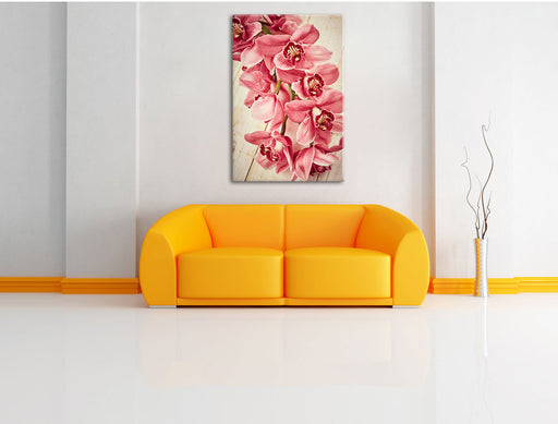 Rosane Orchideenblüten Leinwandbild über Sofa