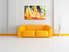 schöne orangene Lilien Leinwandbild über Sofa