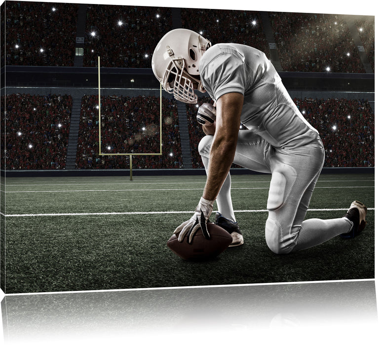 Pixxprint knieender Football-Spieler, Leinwandbild