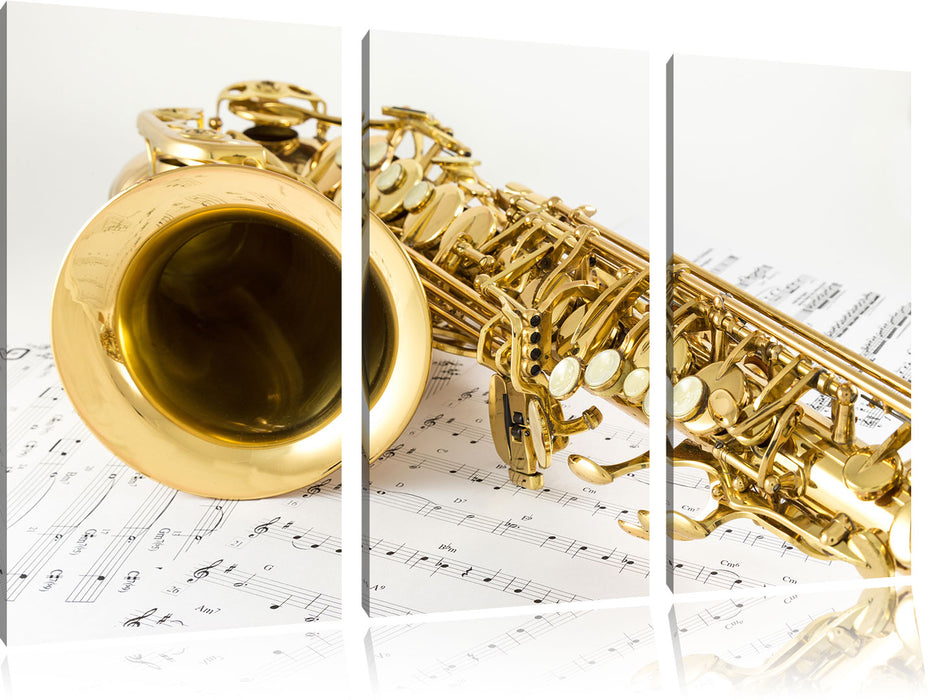 Saxophon auf Notenpapier Leinwandbild 3 Teilig