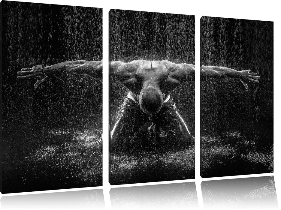Bodybuilder im Regen Leinwandbild 3 Teilig