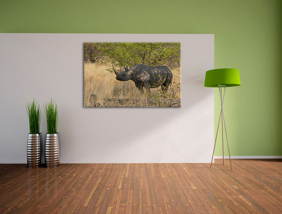 Nashorn in der Savanne Leinwandbild im Flur