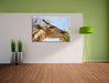 anmutige Giraffe isst Leinwandbild im Flur