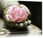 Lotus auf der Hand eines Buddhas Leinwandbild