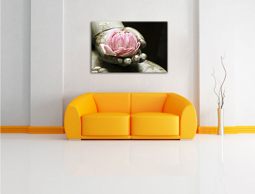 Lotus auf der Hand eines Buddhas Leinwandbild über Sofa