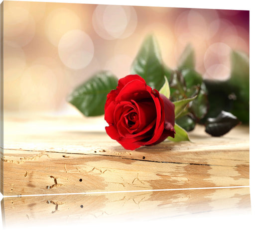 Rose auf Holztisch Leinwandbild
