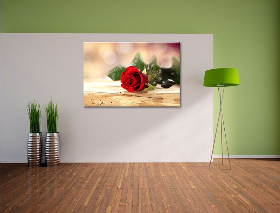 Rose auf Holztisch Leinwandbild im Flur