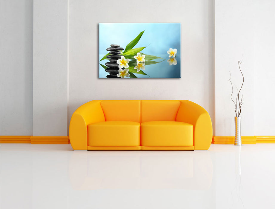 Zen Steinturm Monoi Blüten Leinwandbild über Sofa