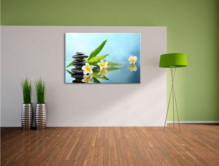 Zen Steinturm Monoi Blüten Leinwandbild im Flur