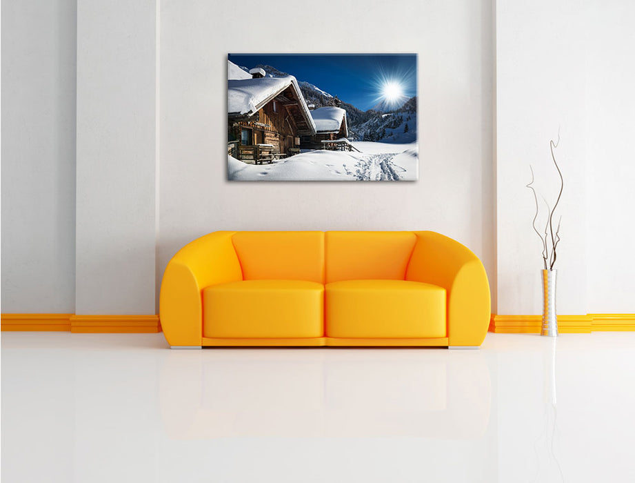 Verschneite Alpenhütte Leinwandbild über Sofa