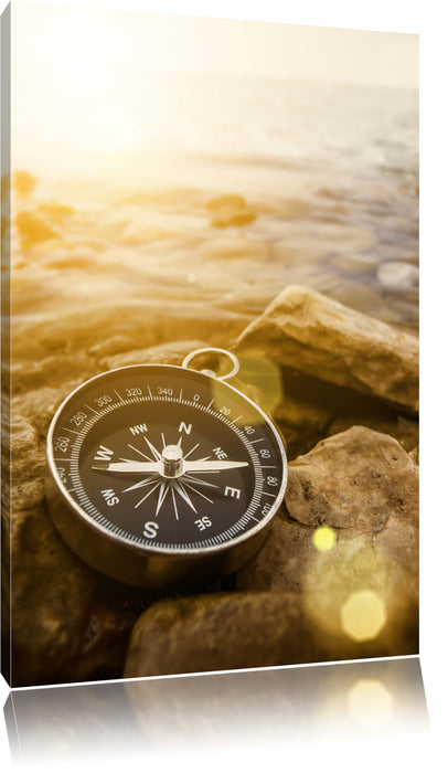 Kompass auf Steinen Reiselust Leinwandbild