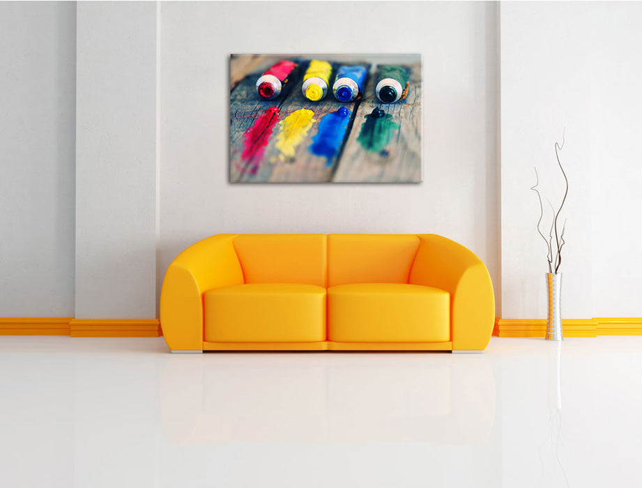 Farbtuben Leinwandbild über Sofa