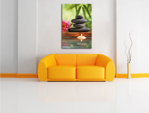 Seerose mit Zen Steinen und Kerzen Leinwandbild über Sofa