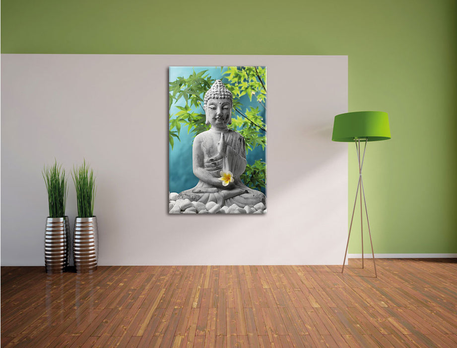 Buddha auf Steinen mit Monoi Blüte Leinwandbild im Flur