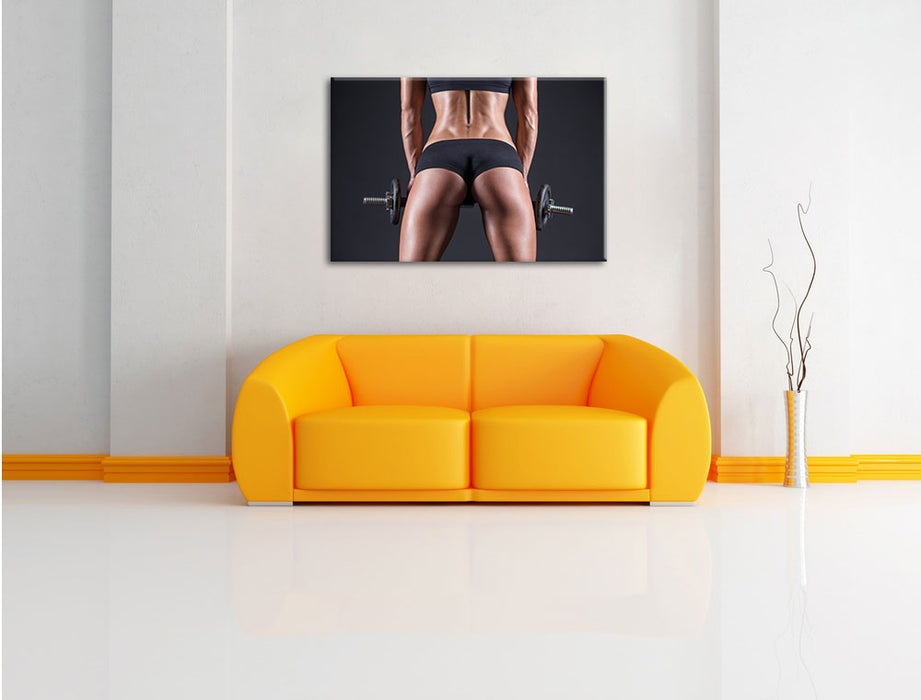 Sexy Frau mit Hanteln Leinwandbild über Sofa