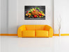 Frisches Obst und Gemüse im Korb Leinwandbild über Sofa