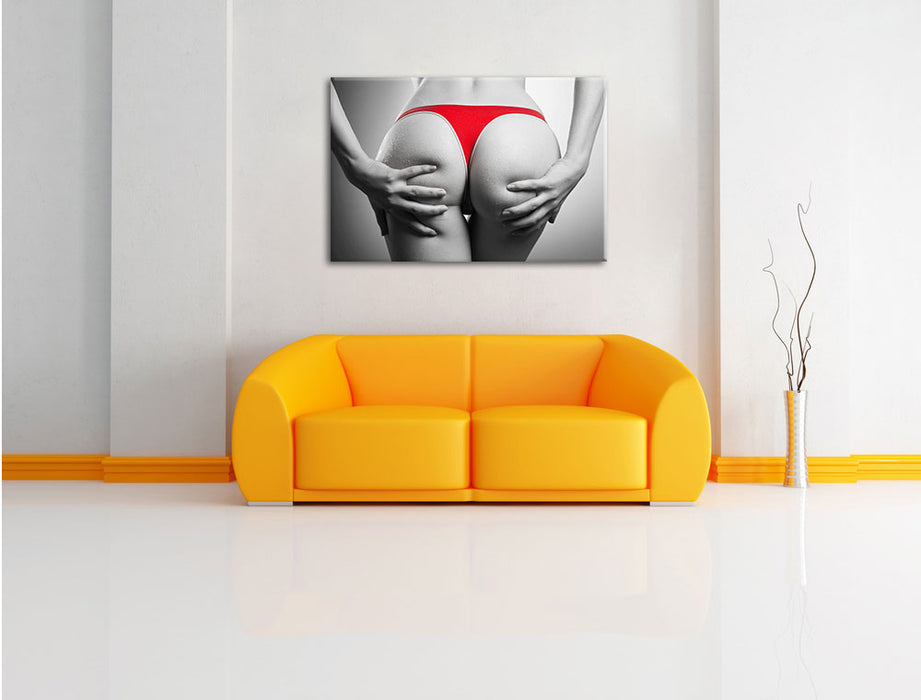 sexy Frauenpo in rotem String Leinwandbild über Sofa