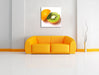 Leckere Kiwi mit Orangenschale Leinwandbild Quadratisch über Sofa
