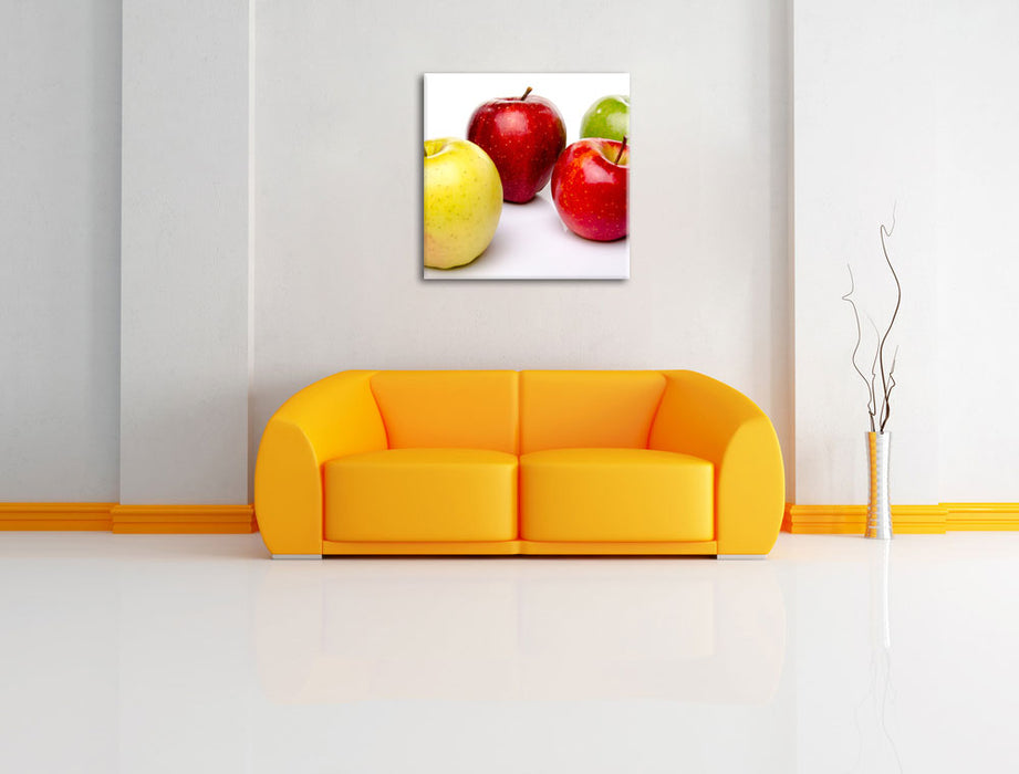 Bunte Äpfel schwarzer Hintergrund Leinwandbild Quadratisch über Sofa