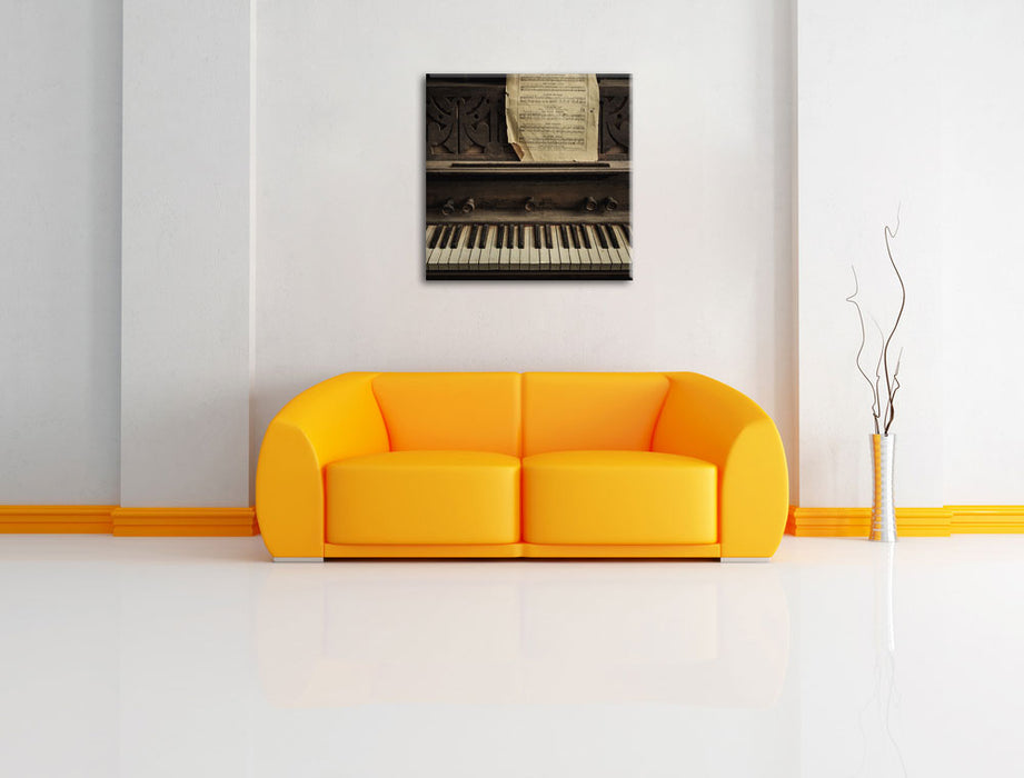 Klavier mit Notenblatt Leinwandbild Quadratisch über Sofa