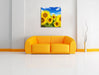 Sonnenblumenwiese unter Himmel Leinwandbild Quadratisch über Sofa