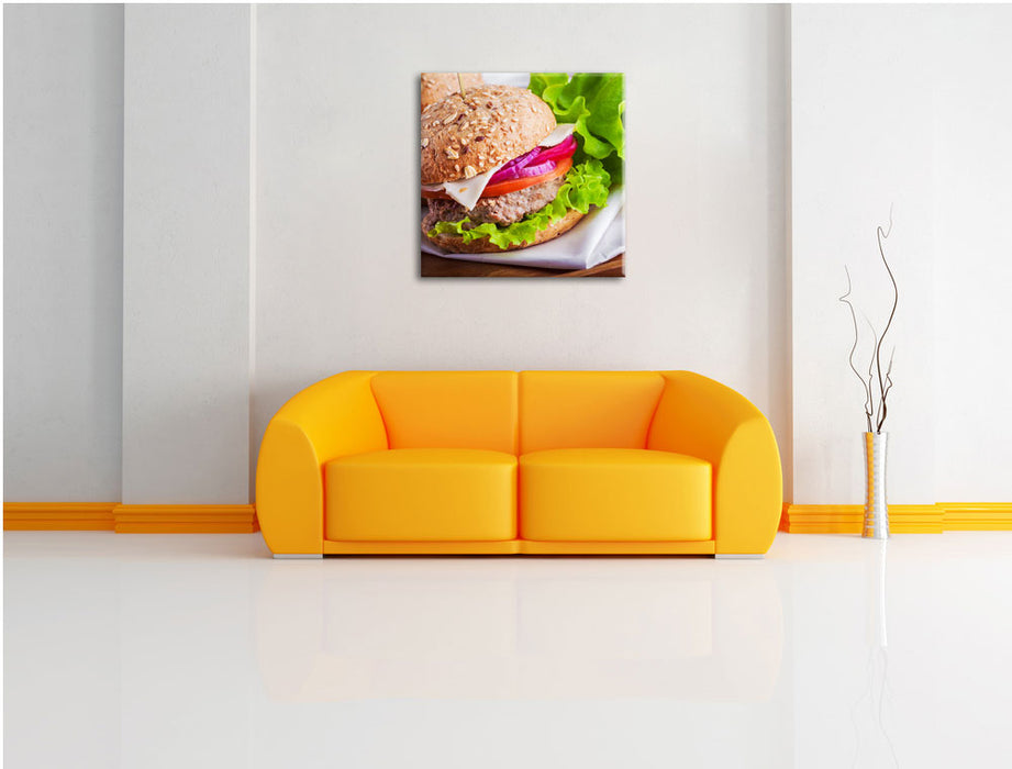 Köstlicher Hamburger Leinwandbild Quadratisch über Sofa