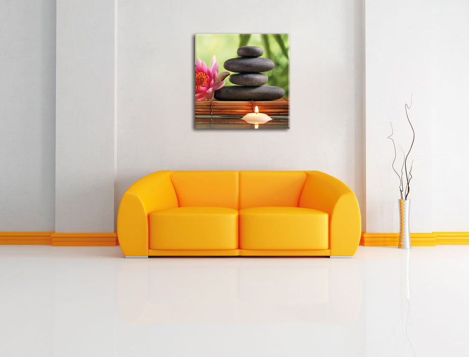Seerose mit Zen Steinen und Kerzen Leinwandbild Quadratisch über Sofa