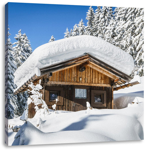 Verschneite Skihütte in Alpenwald Leinwanbild Quadratisch