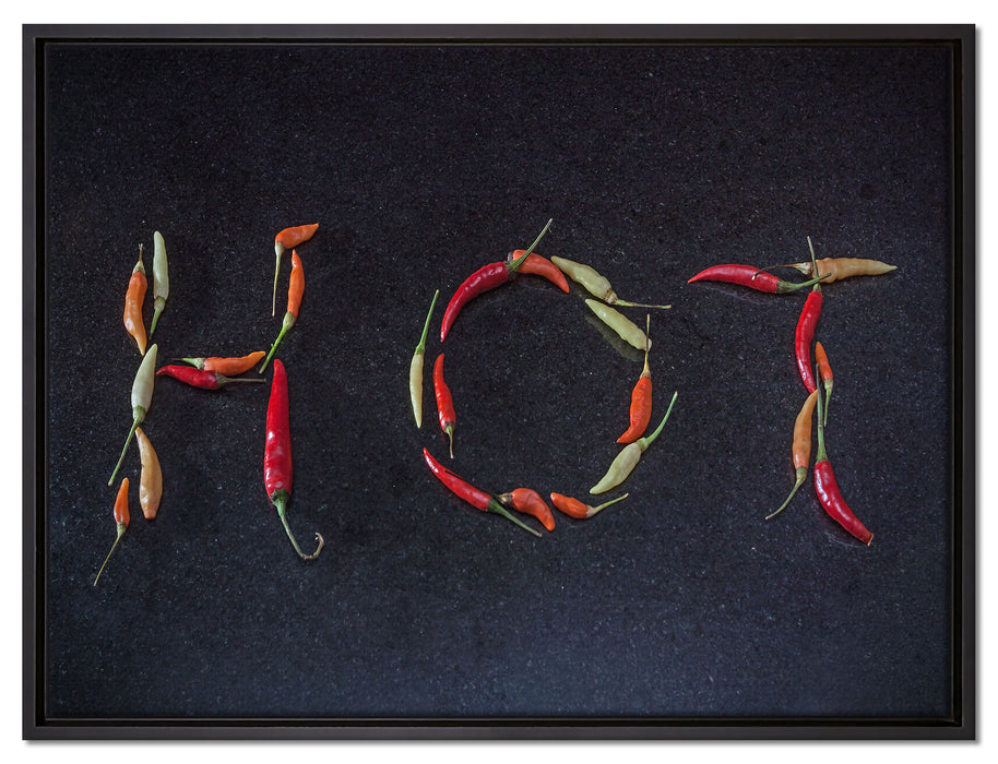 Chilis zu dem Wort Hot geformt auf Leinwandbild gerahmt Größe 80x60