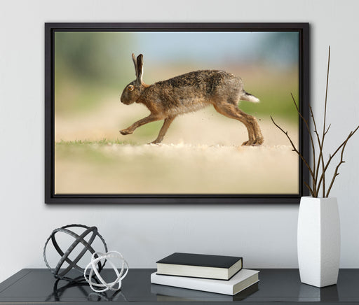 Hüpfender Hase auf Leinwandbild gerahmt mit Kirschblüten