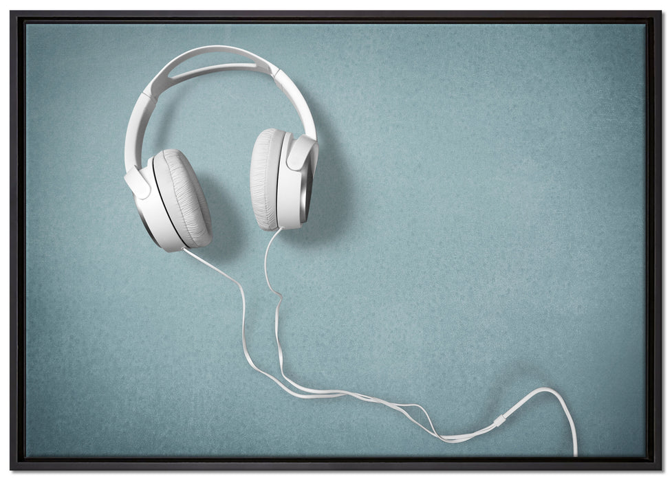 Weiße Kopfhörer auf Leinwandbild gerahmt Größe 100x70
