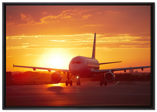 Flugzeug im Sonnenuntergang auf Leinwandbild gerahmt Größe 100x70