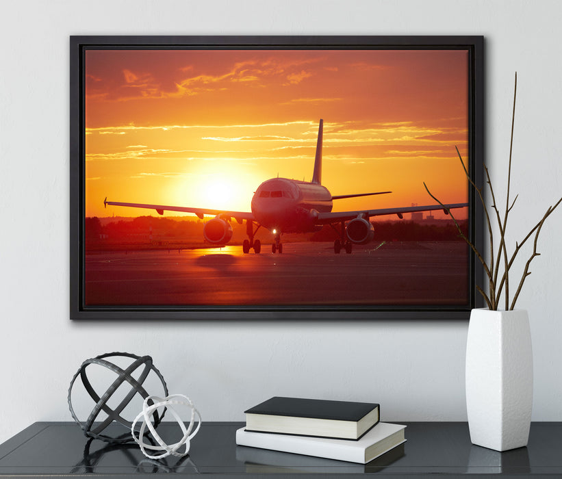 Flugzeug im Sonnenuntergang auf Leinwandbild gerahmt mit Kirschblüten
