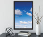 Wolken am blauen Himmel auf Leinwandbild gerahmt mit Kirschblüten