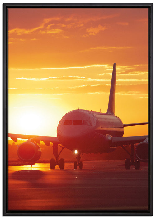 Flugzeug im Sonnenuntergang auf Leinwandbild gerahmt Größe 100x70