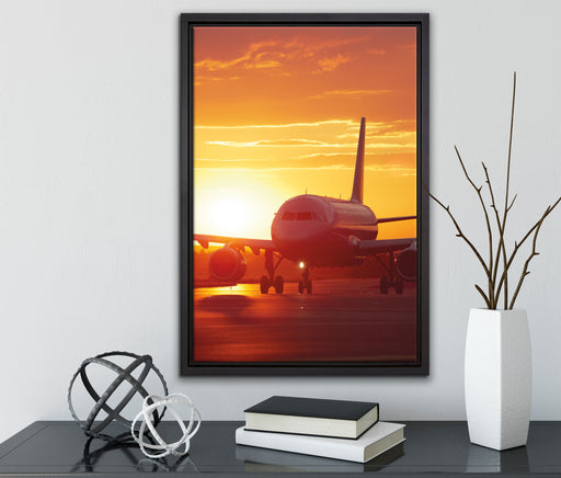 Flugzeug im Sonnenuntergang auf Leinwandbild gerahmt mit Kirschblüten