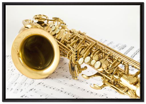 Saxophon auf Notenpapier auf Leinwandbild gerahmt Größe 100x70