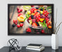 Obstsalat in der Schüssel auf Leinwandbild gerahmt mit Kirschblüten